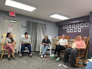 A group of women sitting together in worship.